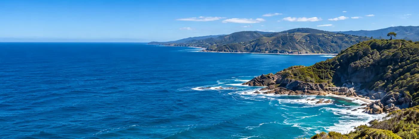 Rugged Australian coastline meeting a deep blue ocean